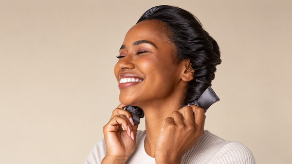 Woman using Charcoal Satin Heatless Curling Set by Kitsch