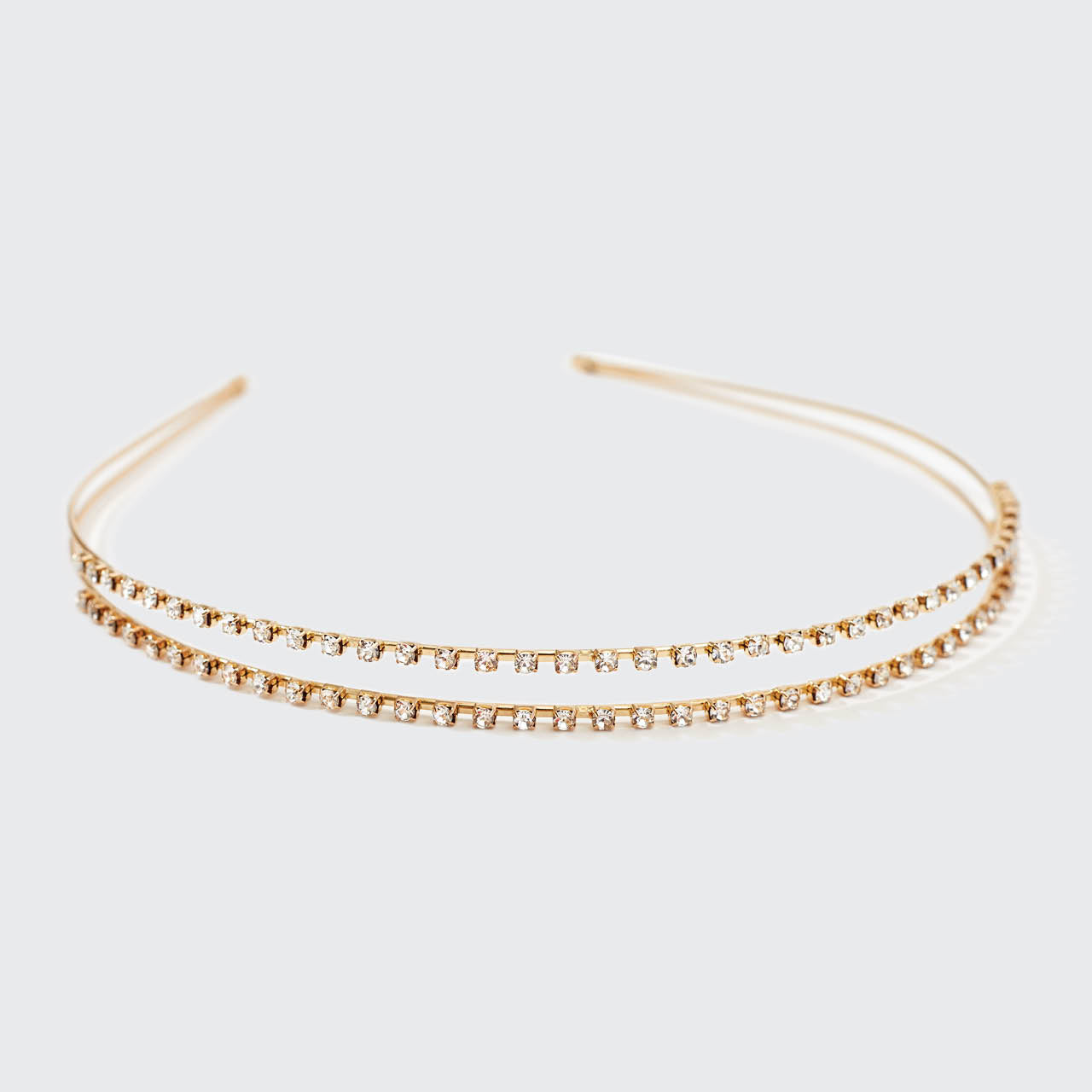 Fascia doppia in metallo dorato con strass