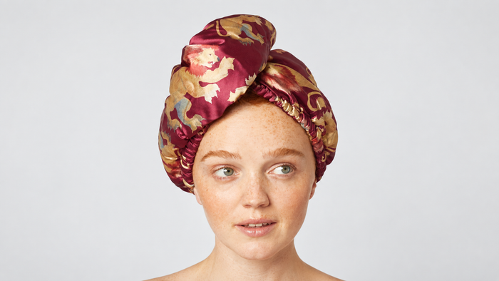 Showcasing Kitsch x Harry Potter Satin Wrapped Hair Towel in Gryffindor by KITSCH