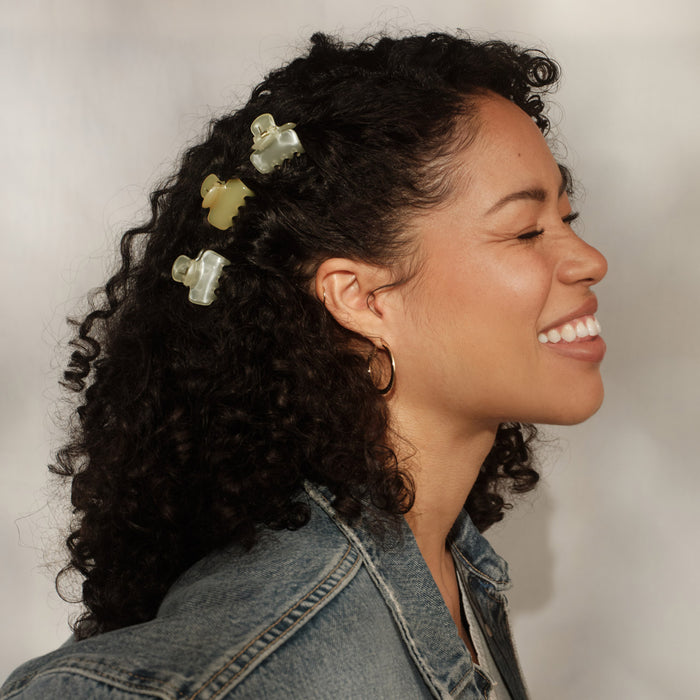 KITSCH Pearlized Cream & Butter Yellow Jelly Cloud Clips Mini — secondary packaging shot with /kit·sch/ packaging card — All-Day Hold | 8pcs — Cloud Clips, Made from Recycled Materials — butter yellow & pearlized cream mini jelly claw clips scattered on white background