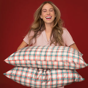 KITSCH Satin Pillowcase in Holiday — model using product — stays cool all night — a nighttime essential for smoother, frizz-free hair