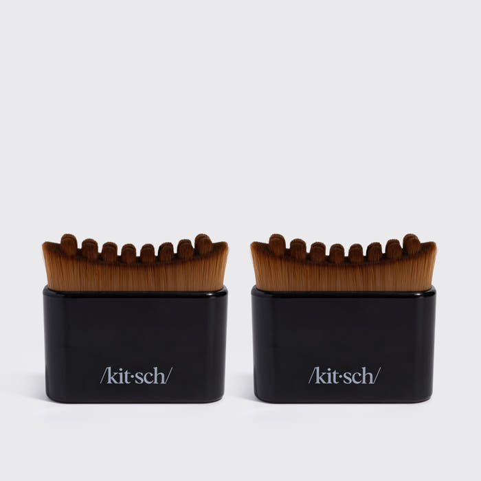 Two black KITSCH Lymphatic Contour Face Brushes, front-facing packaging shot